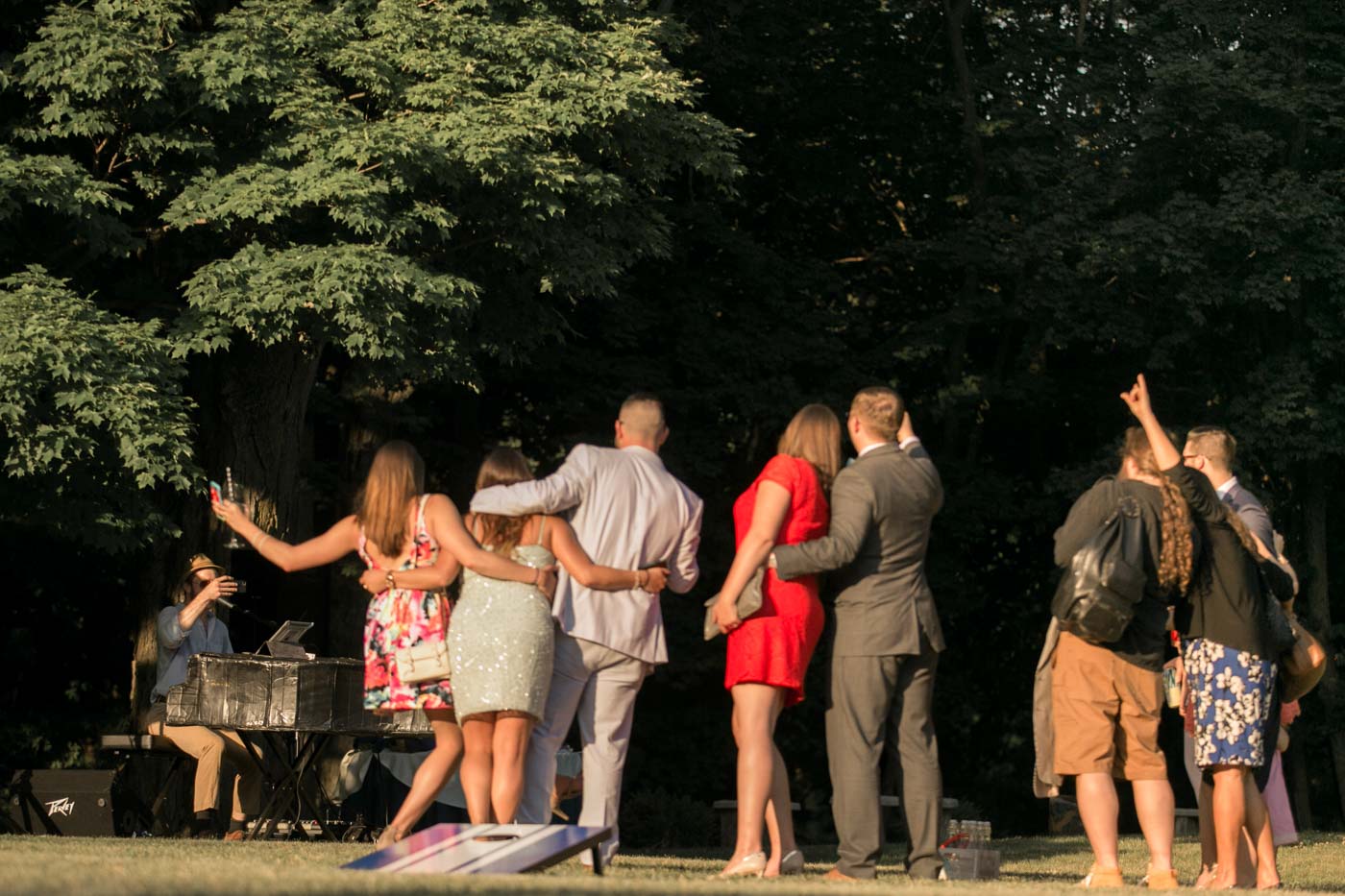 Outdoor Summer Wedding summer-wedding-guests-having-cocktails-on-lawn