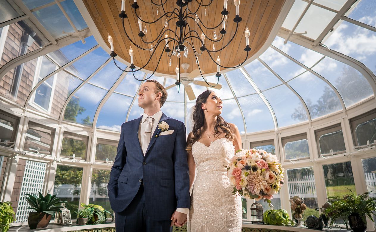 First Loo "Take Two" summer-first-look-couple-hand-in-hand-in-glass-conservatory